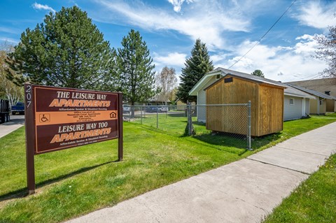 a house with a sign for the park apartments