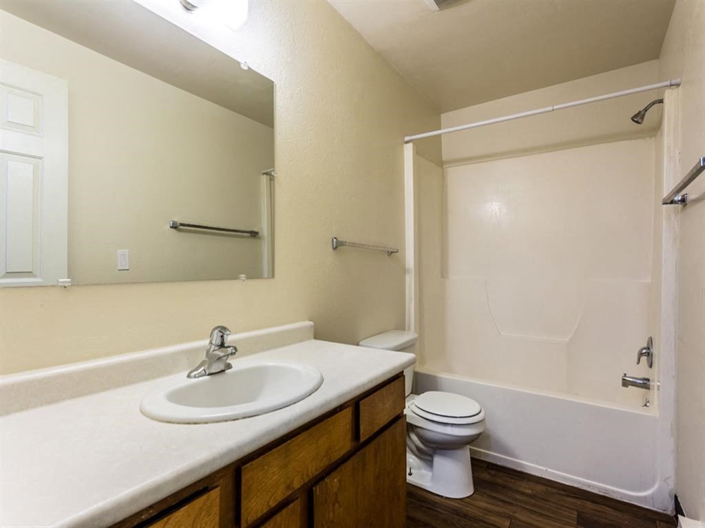a bathroom with a sink toilet and a shower