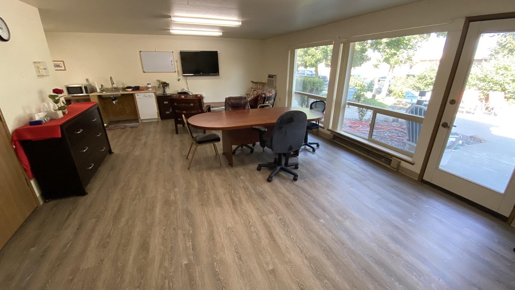 a conference room with a table and chairs