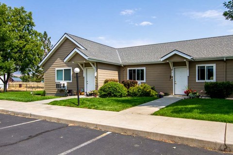 a house with a sidewalk in front of it