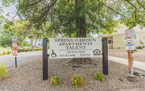 a sign for spring garden apartmentstalent