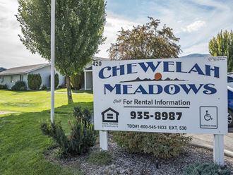 a sign for chivalry meadows is shown in front of a house