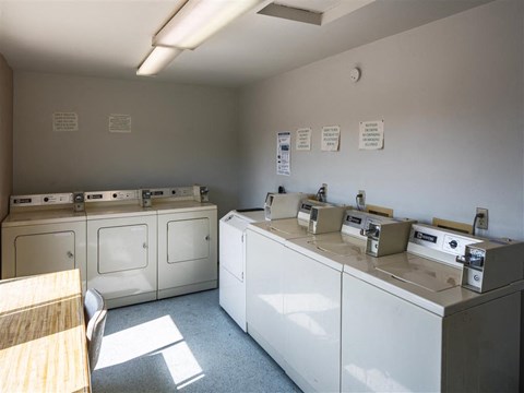 a laundry room with washes and washing machines