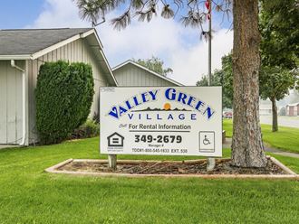 the village sign for valley green village