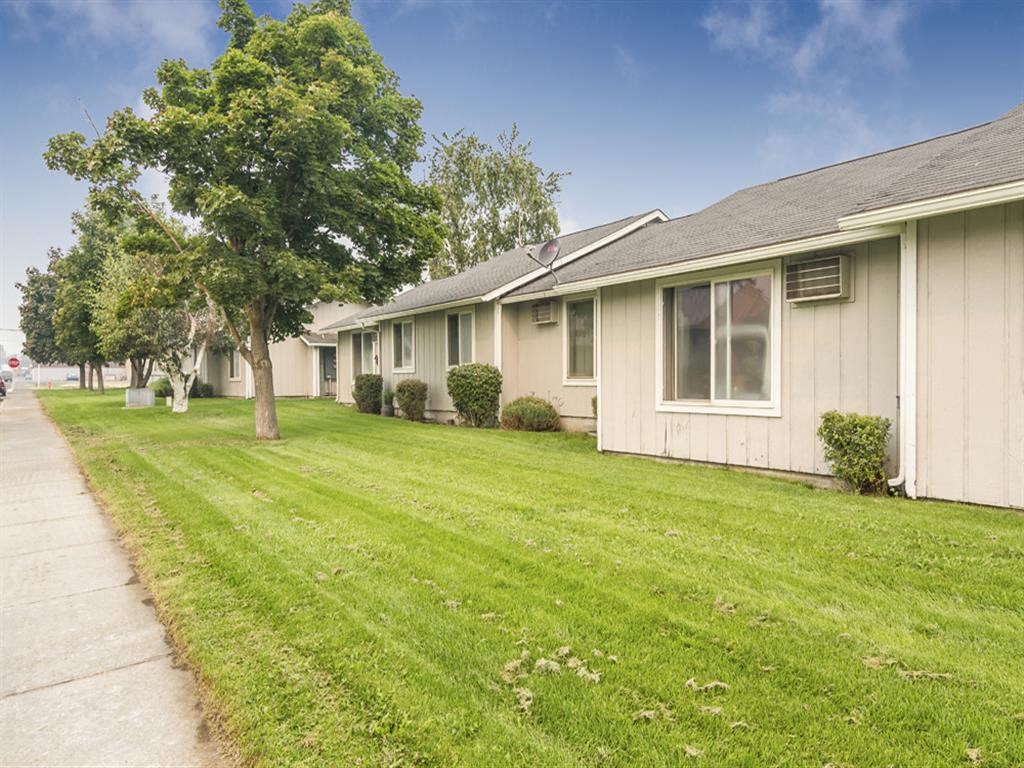a row of houses on the side of a street