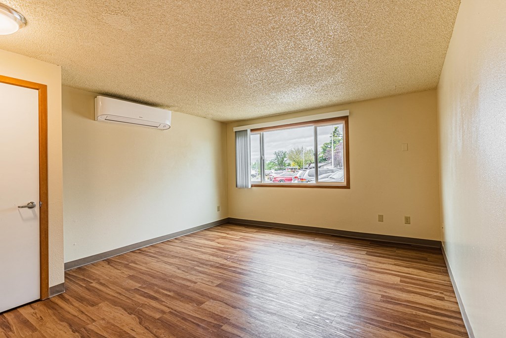 A room with a window and a door.