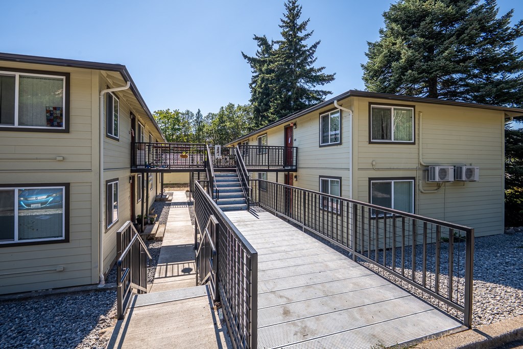 A sunny day at the outdoor deck of a small house.