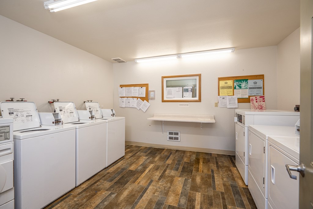 A laundromat with washers and dryers.