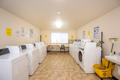 the laundry room is equipped with washes and dryers