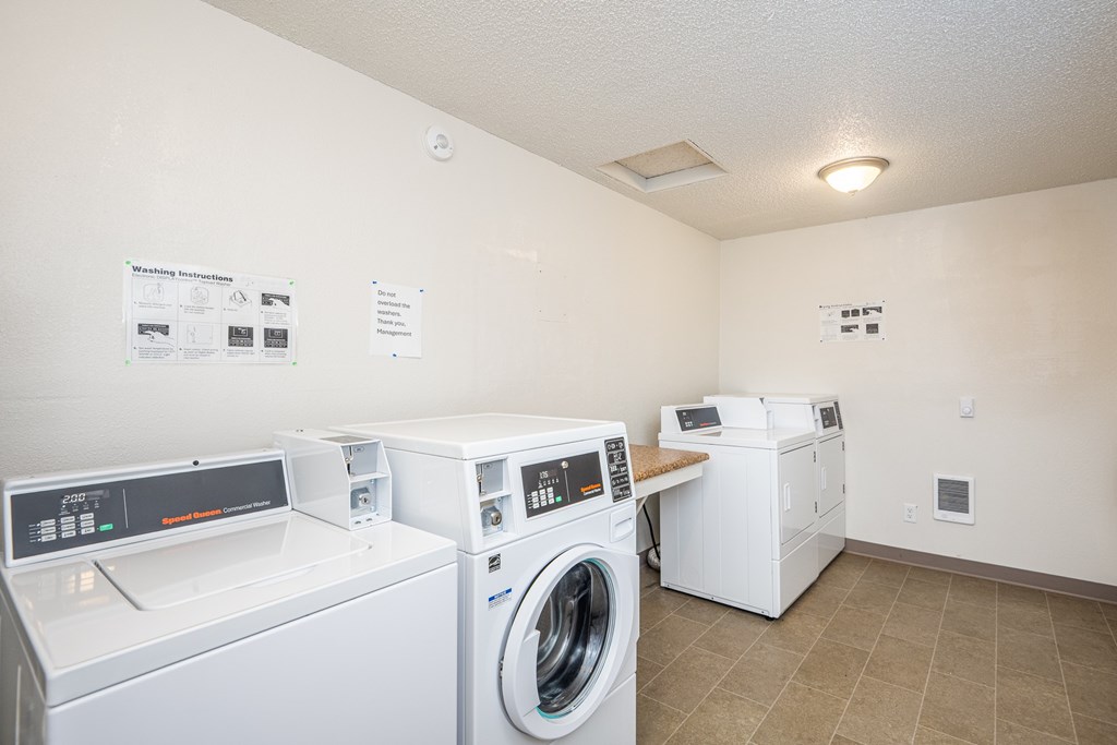 A laundry room with a washer and dryer.