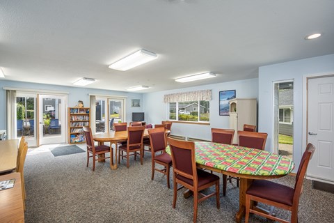 A room with a table and chairs in it.