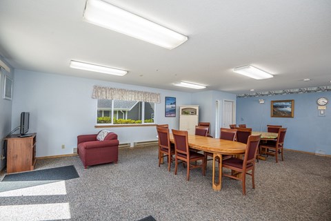 A room with a table and chairs in it.