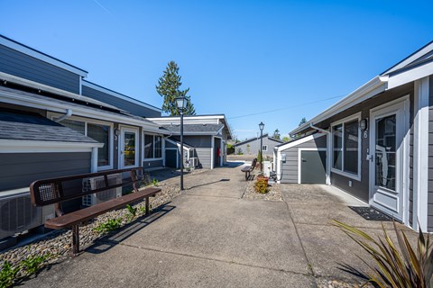 A row of houses with a clear blue sky above.