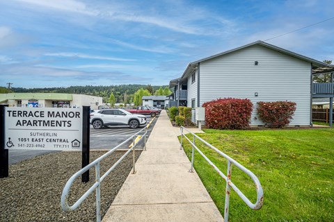 Terrace Manor Apartments is a place with apartments and a car parked in front.