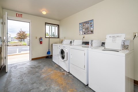 A laundry room with a washer and dryer.