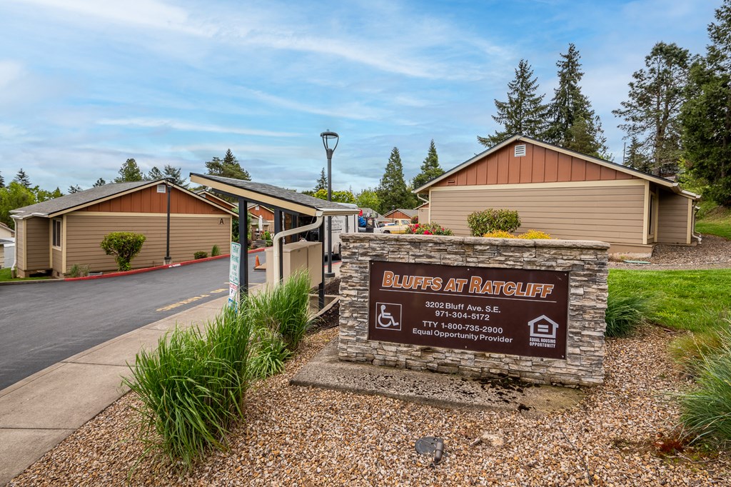 a building with a sign and a road in front of it