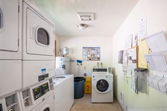 a laundry room with washer and dryer and a washing machine