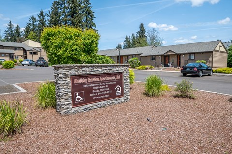 our sign in front of our building in the parking lot