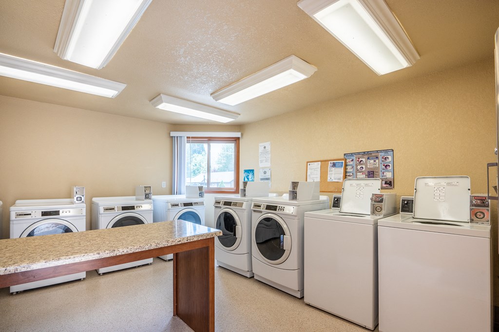 a washer and dryer room in a laundry room with washes and dry