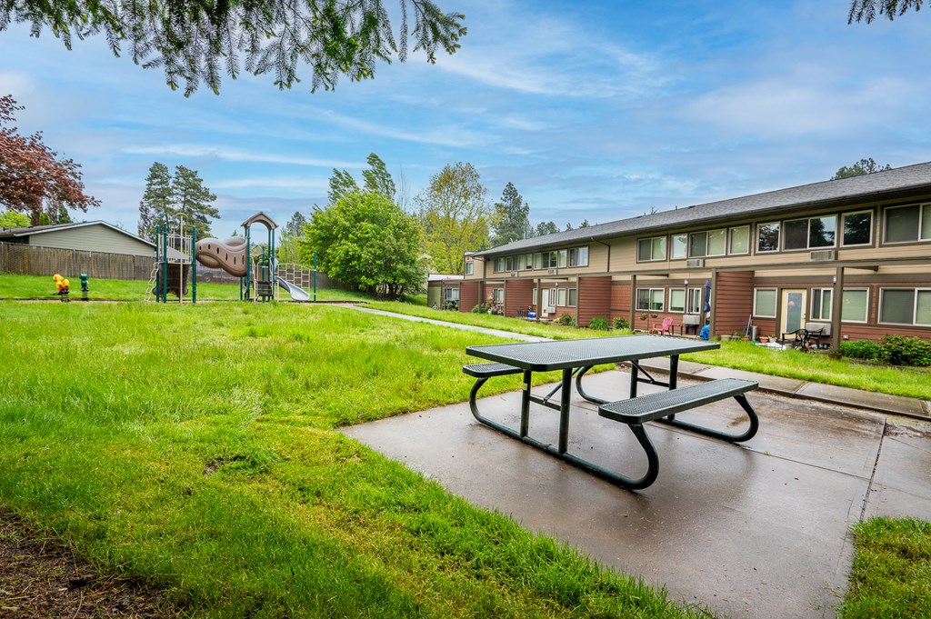 our apartments have a playground and a picnic table