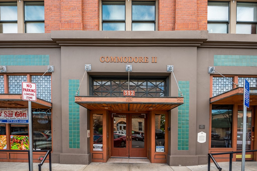 the front of a building with the entrance to commander ii