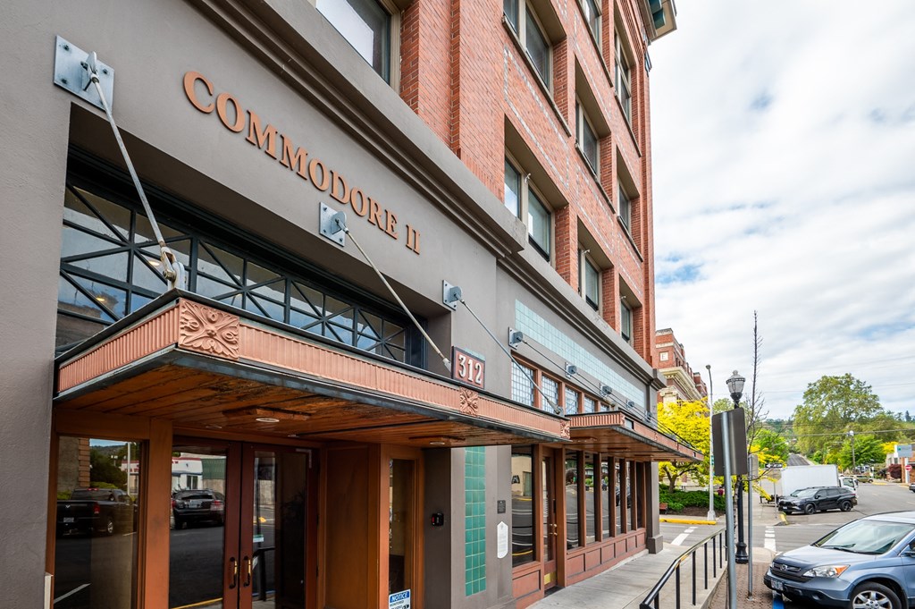the front of a building with the convocation center on the side of the street