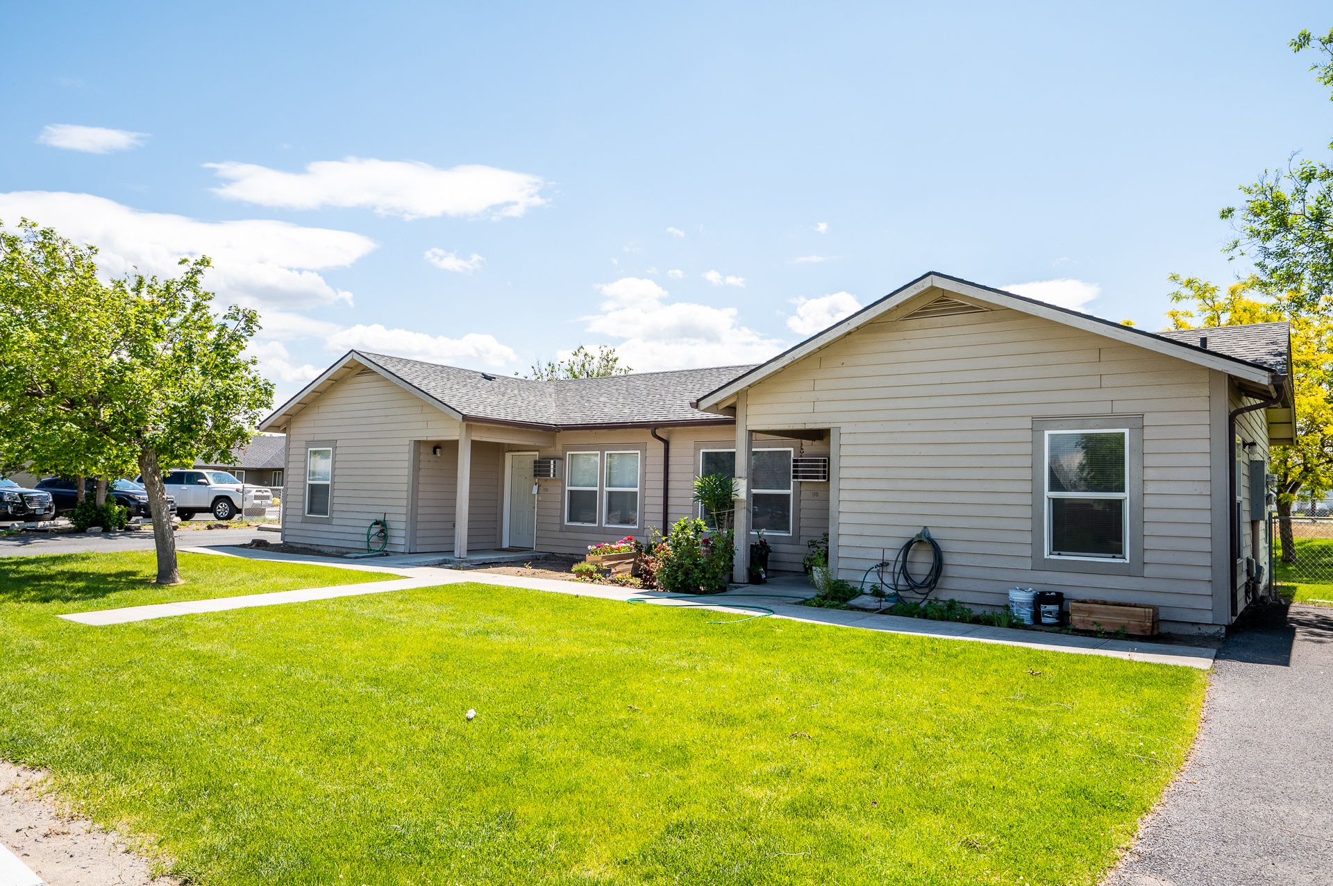 a small house with a lawn in front of it