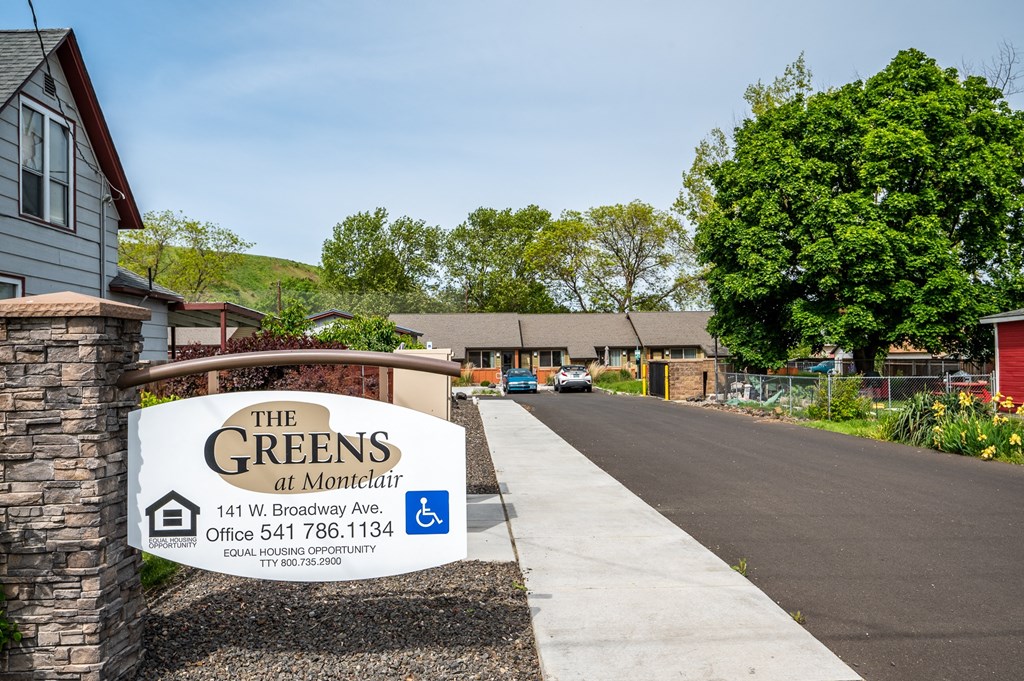 the greens at montgomery sign in front of a house