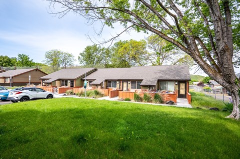 a house with a yard and a parking lot