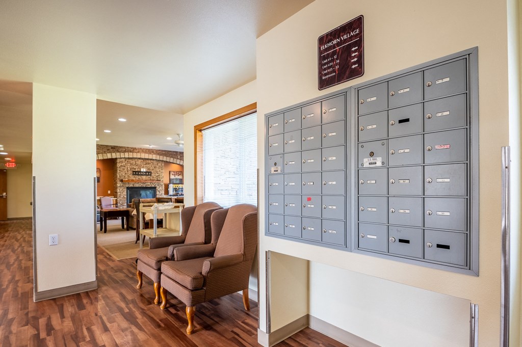 a home office with a large filing cabinet and chairs