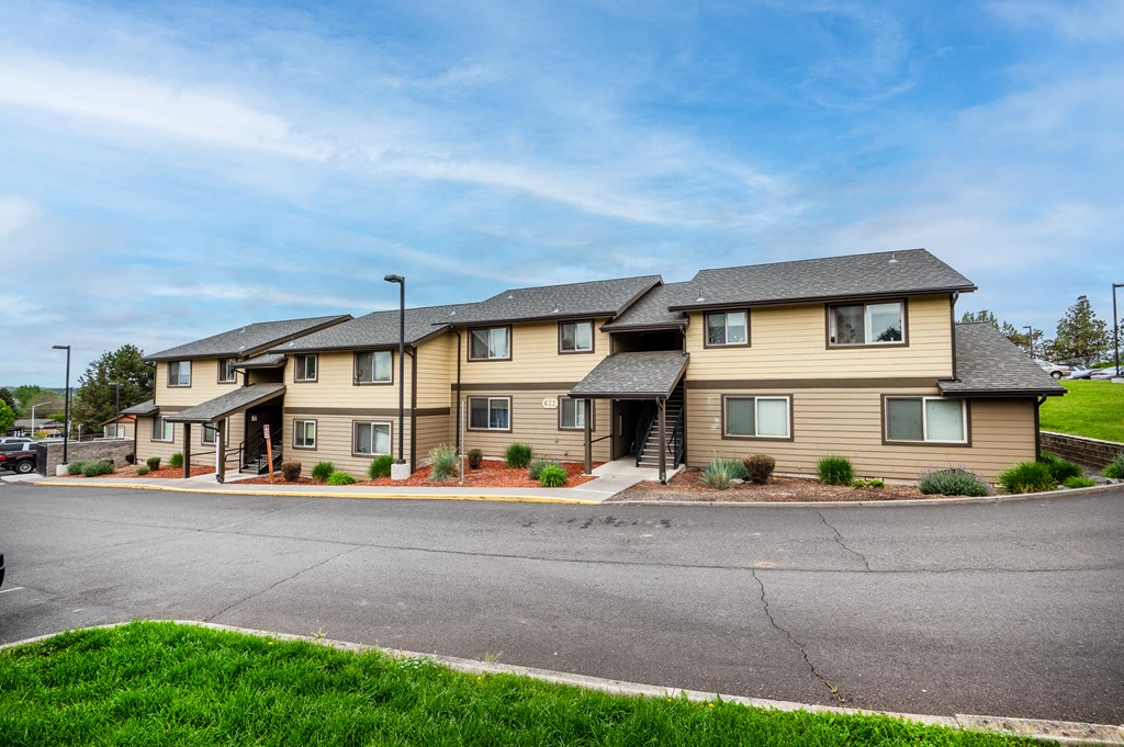 a row of houses on the side of a street