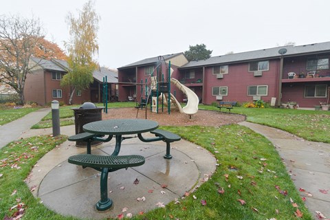 our apartments have a playground and a picnic table