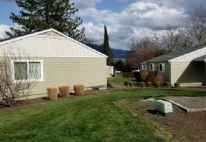a house with a yard in front of it