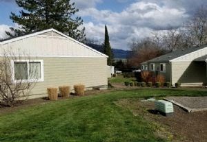 a house with a yard in front of it