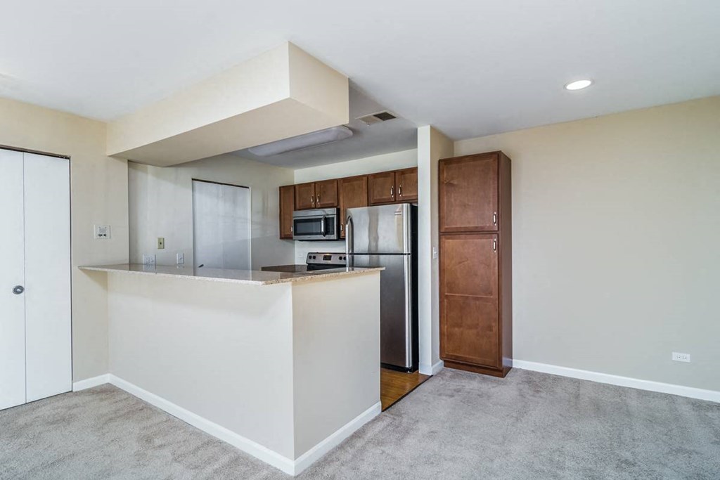 a kitchen with a counter top and a refrigerator