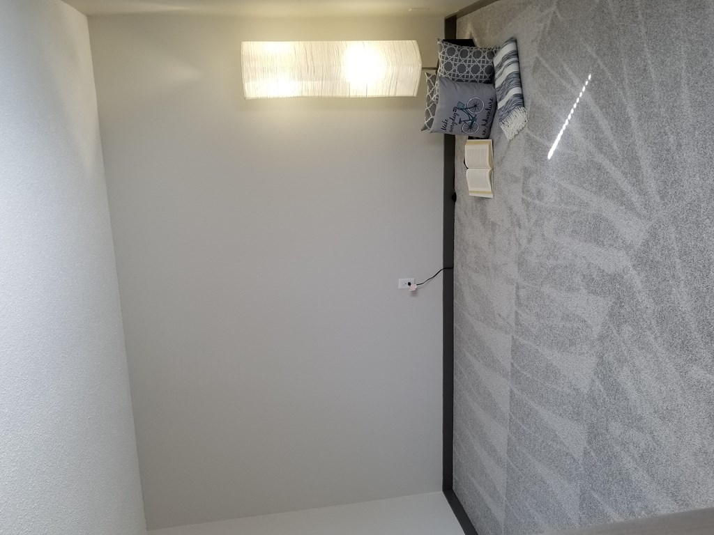 the door to the bathroom is open and the light is on