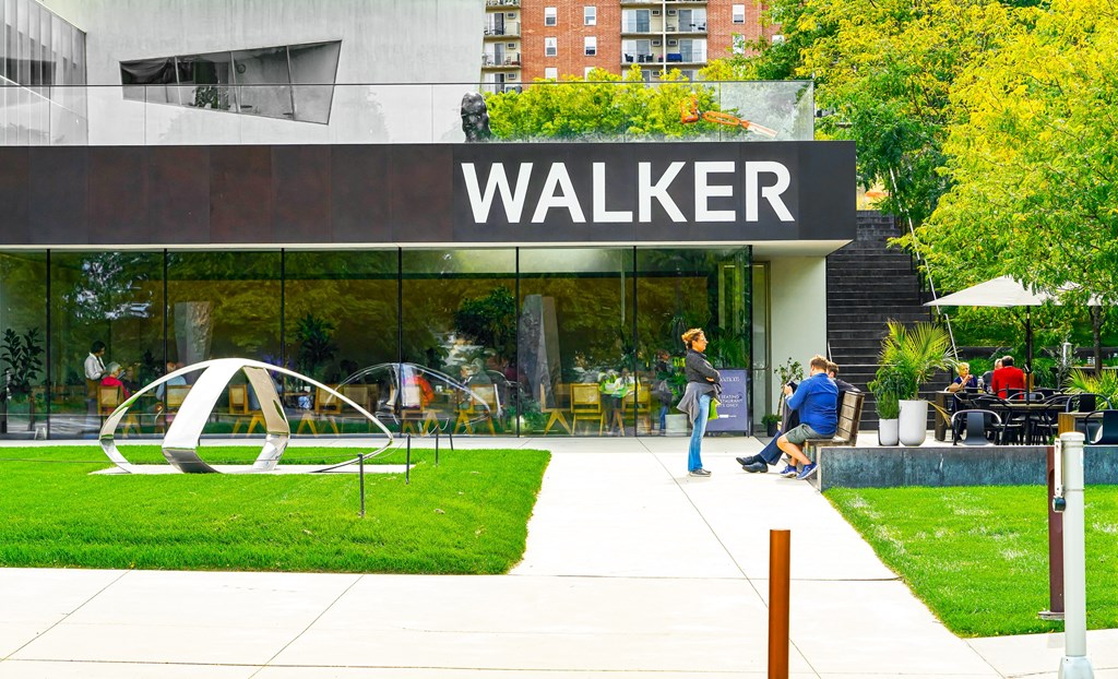 pedestrians walk past the walker building at the wicker park mall