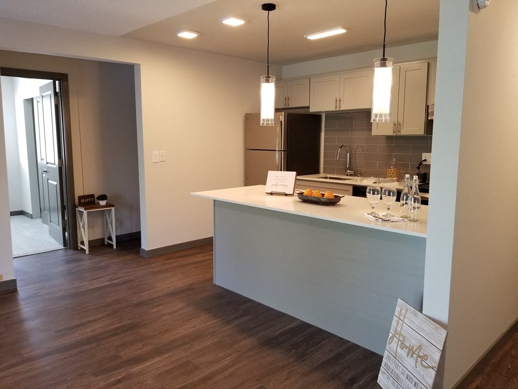 a view of the kitchen and living room from the dining room