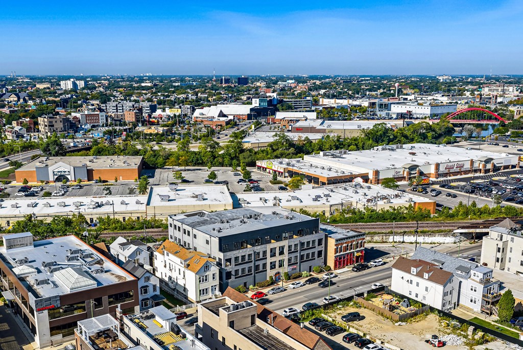 A cityscape with buildings and a clear sky.