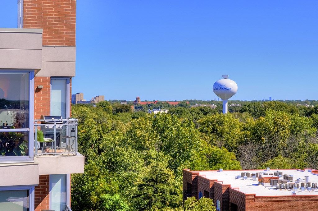 a view of a city from a building with a water tower