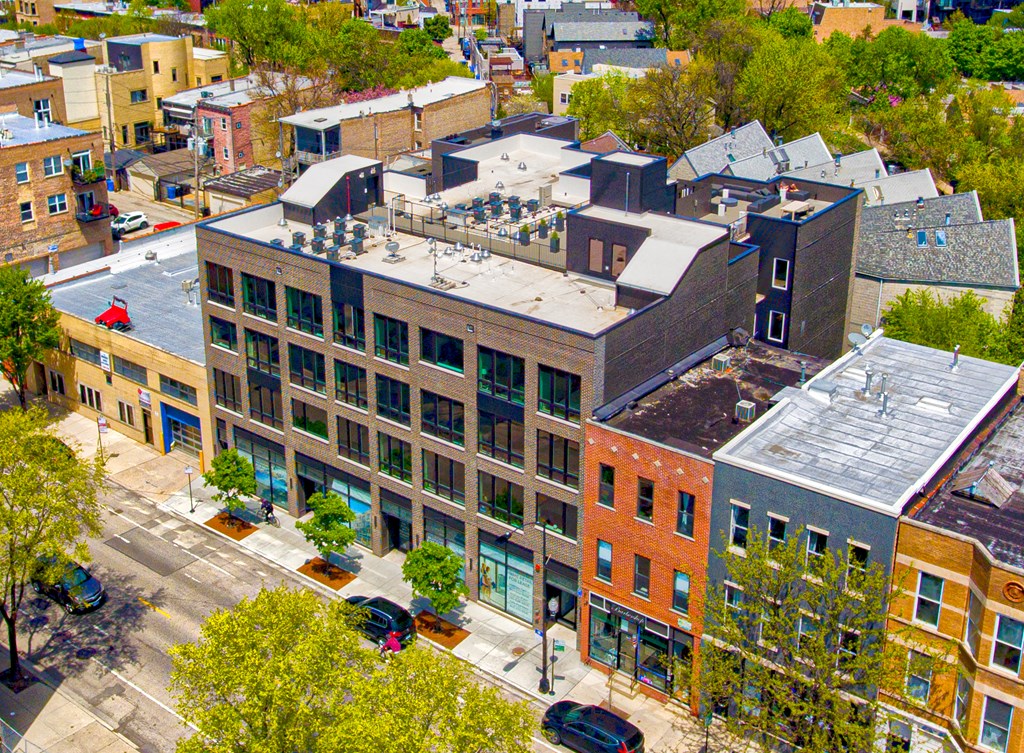 a view from above of a city street and buildings