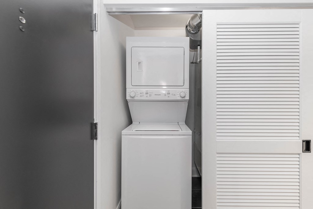a small laundry room with a washer and dryer