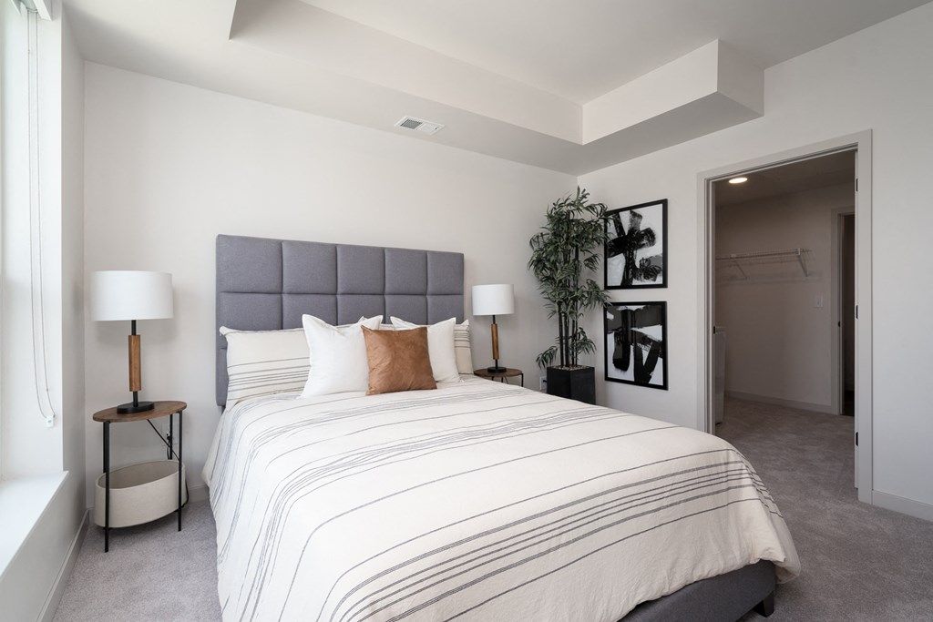 a bedroom with a large bed and a closet