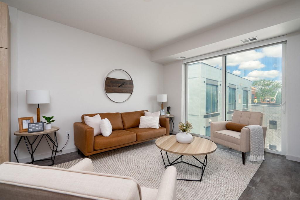 a living room with a couch and two chairs