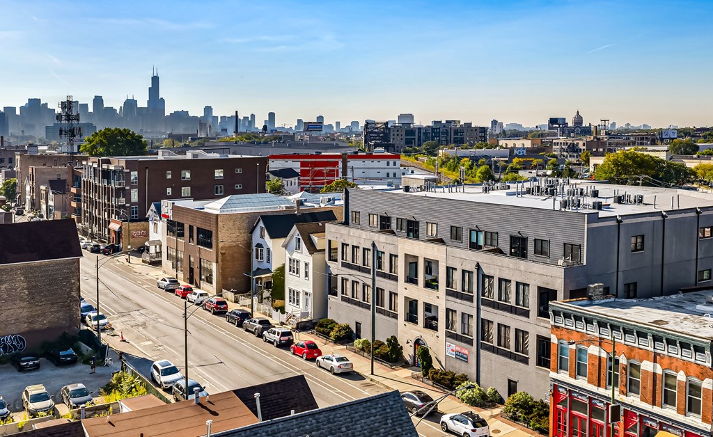 A city street with cars and buildings.