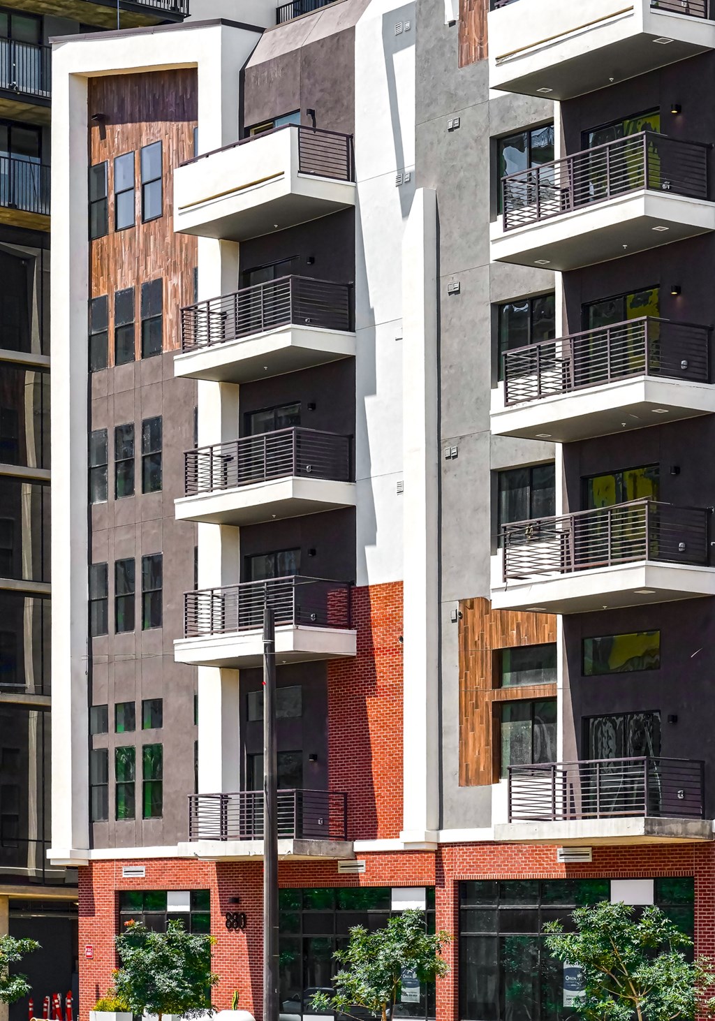 A modern building with balconies and windows.