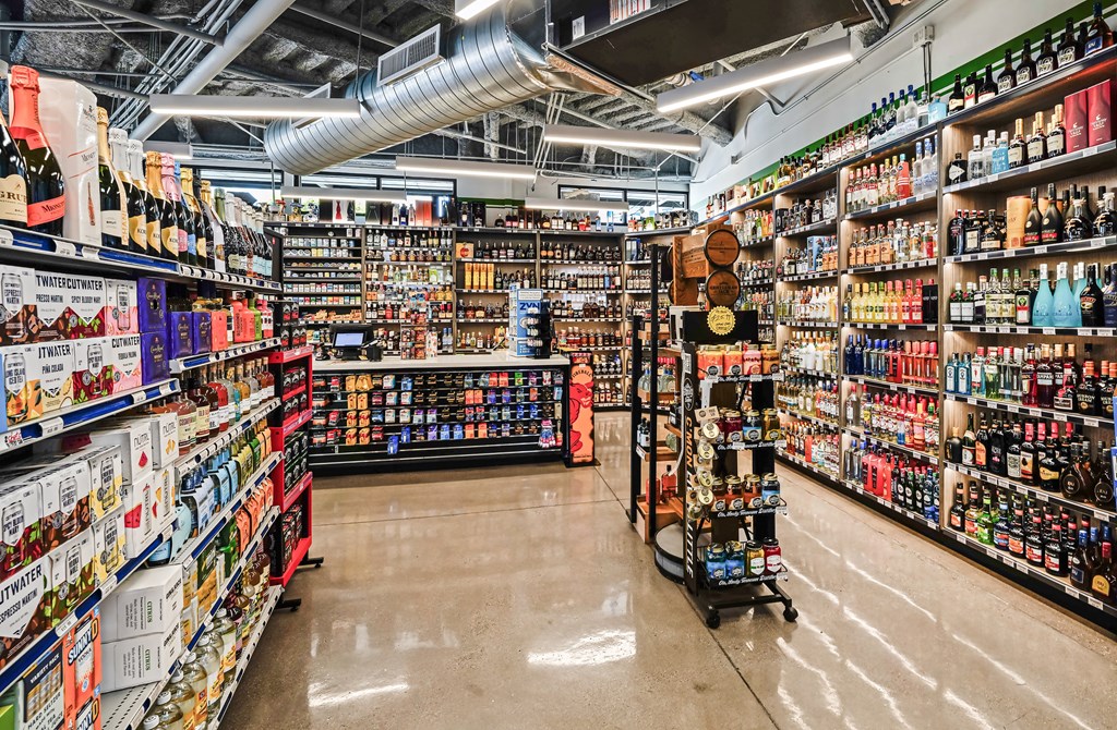 A liquor store with a variety of bottles on the shelves.