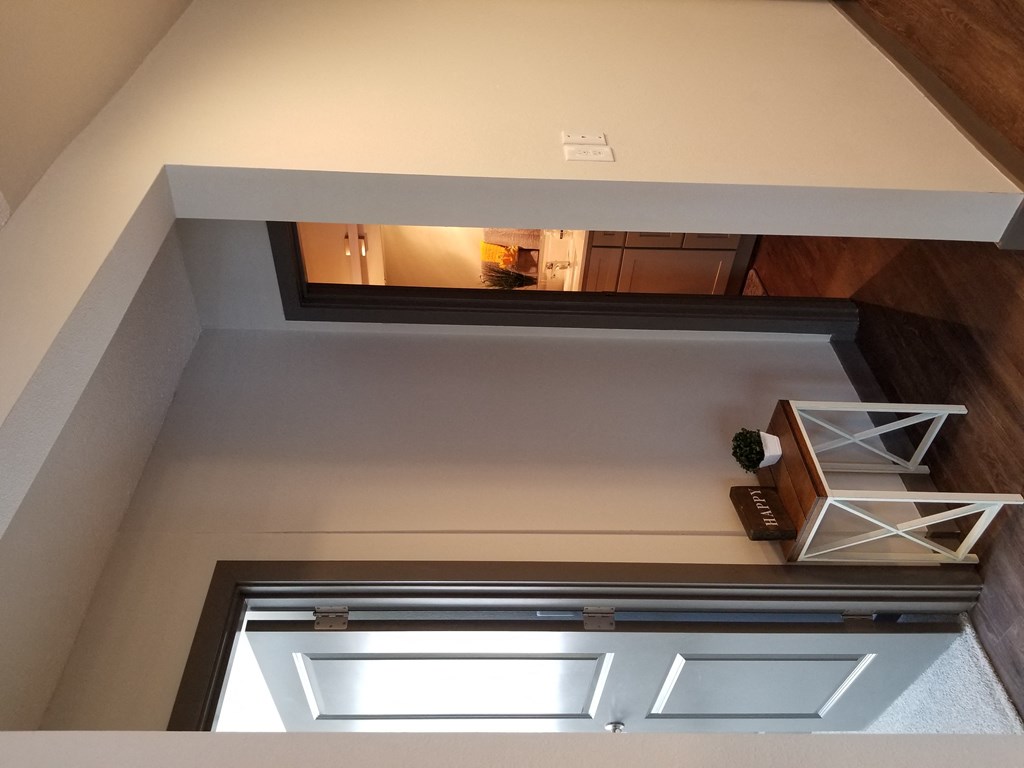 looking down into the living room from the loft