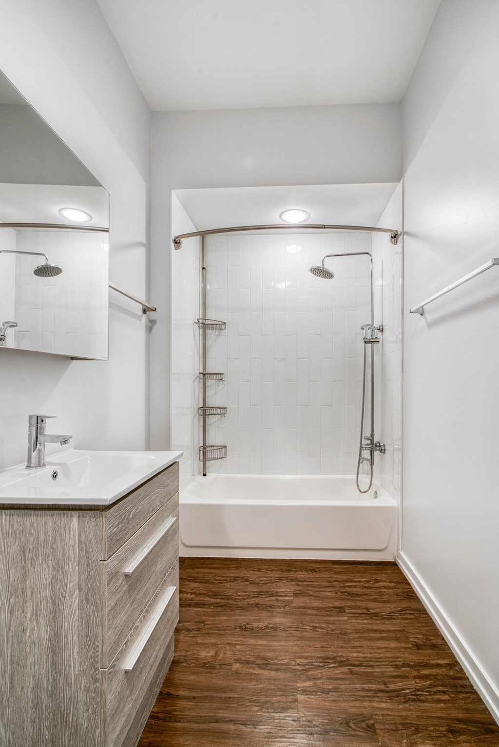 a small bathroom with a shower and a sink