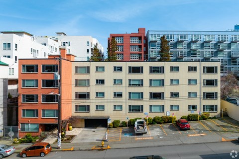 south facade of the building with parking lot in front of it